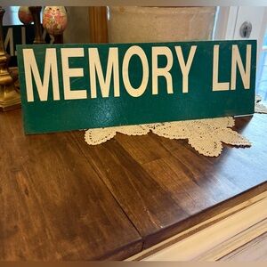 Memory Ln  green double sided sign. Primitive memories county.